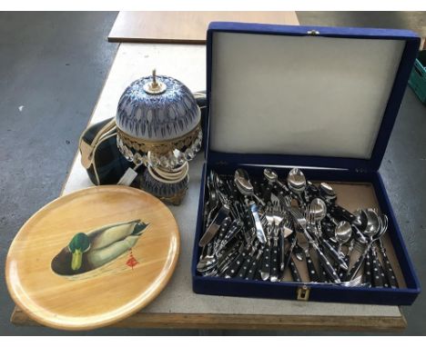 A matched canteen of Rostfrei and Cult flatware, together with a lazy susan depicting a duck, and a bag of knitting needles; 