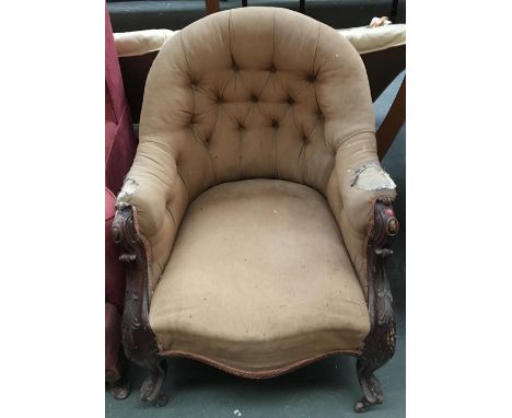 A button back armchair with serpentine front and carved cabriole legs 