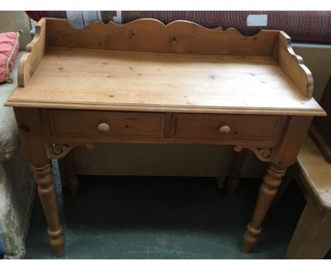 A pine side table with gallery top over two drawers, 91x75cmH 
