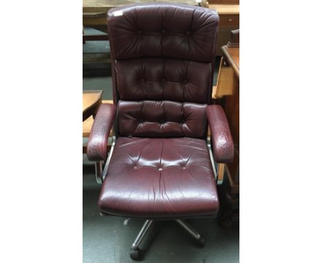 A 1970s leather button back office chair with adjustable chrome base 