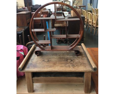 eastern style low table with scrolling ends and an oriental table top shelf system 