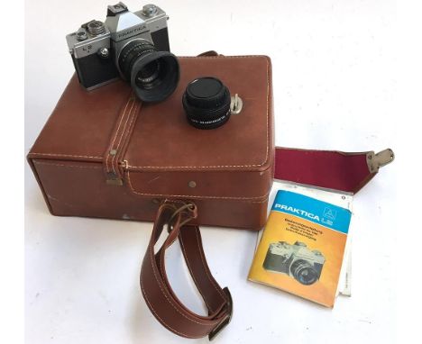 A Praktika L2 35mm camera in carry case, with instruction manual and spare lens 