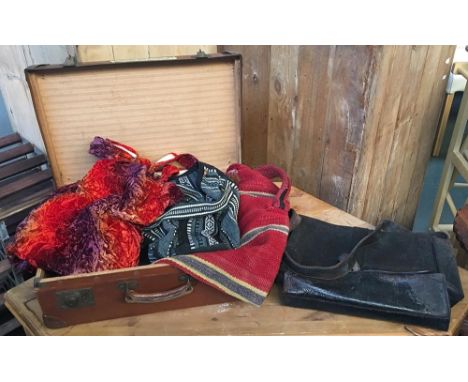 Vintage brown suitcase together with three ethnic bags and a large black leather satchel 