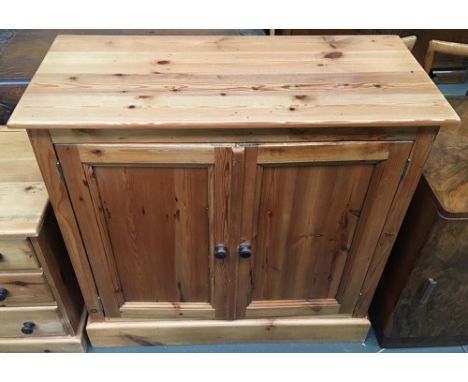 A pine cupboard with two doors and one shelf on plinth base, 90x90cmH 