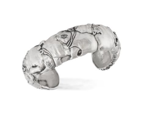 PATRICK MAVROS: A SILVER BANGLE, CIRCA 2012Of cuff-bangle design, depicting motifs of rhinos, in silver, signed Patrick Mavro