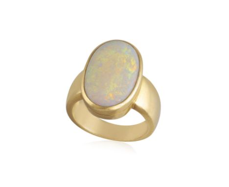 A GOLD AND OPAL RINGCollet-set with an oval-shaped cabochon opal, to a tapered mount, mounted in 18K gold, ring size P½  Cond