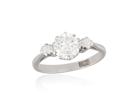 A DIAMOND RING Set with an old European-cut diamond weighing approximately 1.10cts, flanked by old European-cut diamonds, mou
