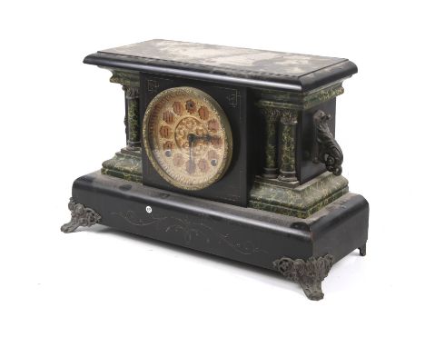 A Victorian mantel clock. The gilt and red dial having Arabic numerals, in a black case of architectural form and column deta