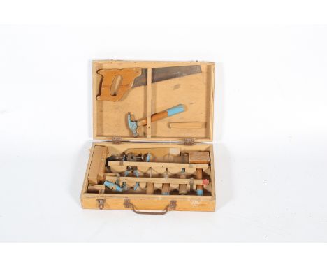 A childrens tool kit within a wooden box. Containing a good range of tools including a plane, hammer, saw and G clamp etc, al