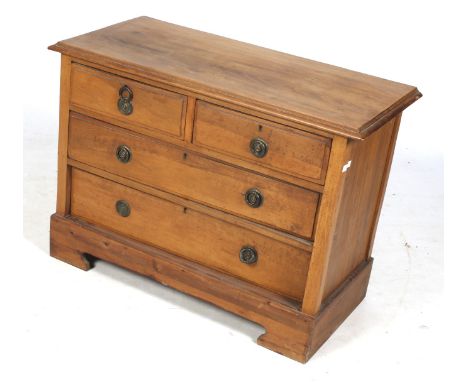 A contemporary small chest of drawers. Moulded edges, two short over two long graduated drawers all with ring handles, on bra