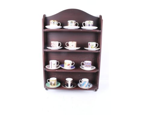 The Coalport Musuem Historic Coffee Cup Collection. Twelve assorted cups and saucers with a display rack. H81cm