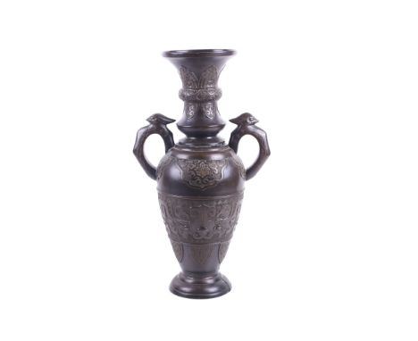An early 20th century large Japanese inlaid bronze urn. With two bird or phoenix headed shaped handles, the neck and body wit