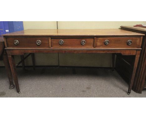 An Edwardian hall table converted from a piano/spinette. The mahogany frame having inlaid decoration and banding, three drawe