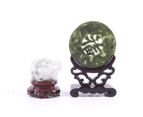 Two 20th century Chinese hardstone carvings. Including a pale blue and green stained jadeite paperweight in the form of the H