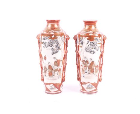 A pair of large Japanese Meiji period Kutani vases. Each decorated with scholars playing go, and birds amongst flowers, with 