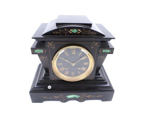A Victorian slate and malachite mantel clock. Striking to a bell, pendulum present, black dial, gold Roman numerals, gilt bez