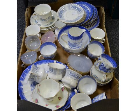 A Kays & Co of Worcester willow pattern part tea service comprising five cups, nine saucers, five side plates, milk jug, suga