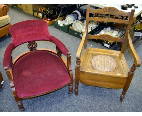 A Victorian mahogany tub chair, pierced, carved to frieze, turned legs c 1880; a Victorian mahogany commode chair, hinged rat