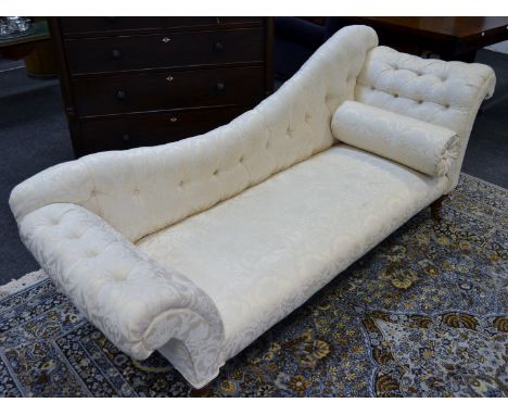 A Victorian Day bed,  upholstered in cream , conforming scroll cushion 