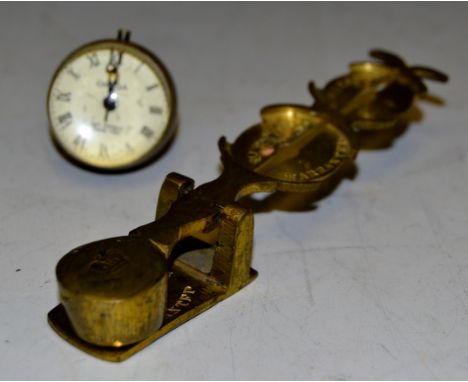 An Omega Bulls eye fob; a set of brass sovereign scales (2)