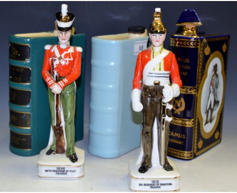 A pair of Continental porcelain figures of Soldiers in regimental costume; Napoleon cognac decanter in the form of a book; ot