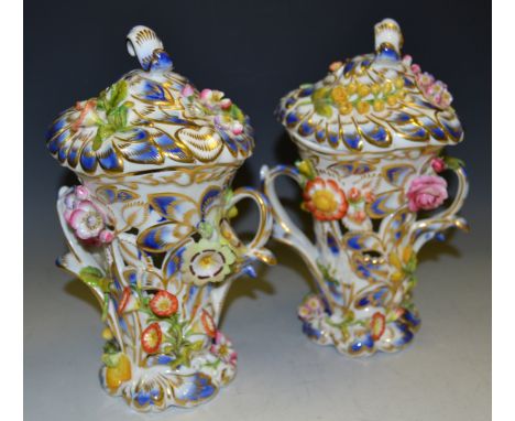 A pair of Chamberlain Worcester flower encrusted pot pourri and cover, with the Chamberlain and Co New Bond Street mark from 