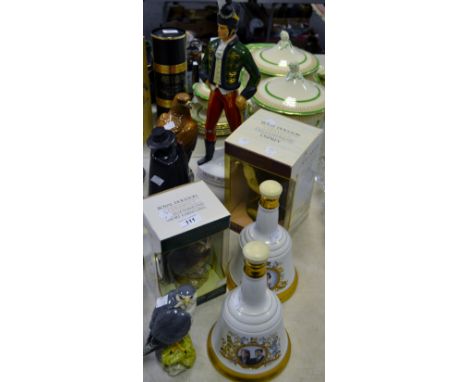 An Irish Mist liqueur bottle in the form of an Irish Guardsman; a Beneagles whisky bottle decanter in the form of a Golden Ea
