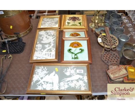 A collection of various Art Nouveau pottery tiles, framed