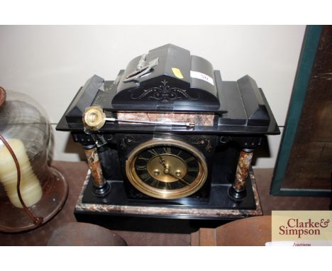 A Victorian marble cased mantle clock of architectural form
