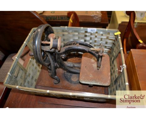 A Wilcox &amp; Gibbs vintage sewing machine in wicker basket