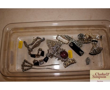 A collection of various Art Deco and other diamante brooches etc