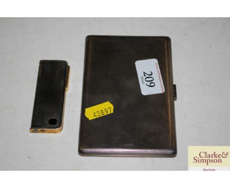A silver engine turned cigarette case and a Colibri lighter