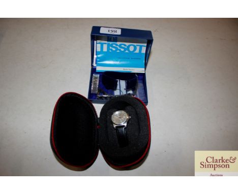 A Tissot 1853 PR100 automatic cased wrist watch and straps etc
