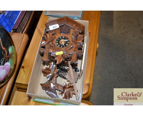 A wooden cased cuckoo clock