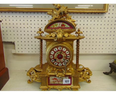 An Ormulu and porcelain mantle clock
