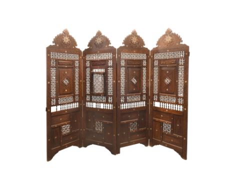 λ A MOTHER-OF-PEARL-INLAID CARVED AND PIERCED HARDWOOD FOLDABLE SCREEN Ottoman Syria, late 19th - first half 20th centuryOf t