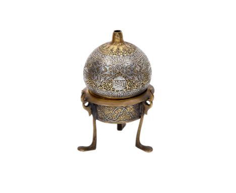 A SILVER-INLAID OPENWORK MAMLUK-REVIVAL BRASS INCENSE BURNER Cairo, Egypt, first half 20th centuryThe removable, pierced lid 