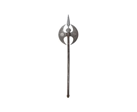 A QAJAR ENGRAVED SILVER-INLAID STEEL AXE (TABAR)   Qajar Iran, 19th century  Of typical shape, with a slender faceted steel s
