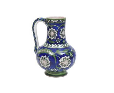 AN IZNIK-STYLE POTTERY JUG WITH ROSETTES AND SAZ LEAVES Tehran, Qajar Iran, ca. 1880 - 1900Of baluster shape, with a globular