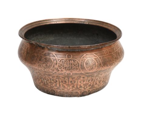 A LARGE INCISED TINNED COPPER BASIN WITH ELABORATE VEGETAL MOTIFS Possibly Mamluk Syria, late 15th - early 16th centuryOf dee