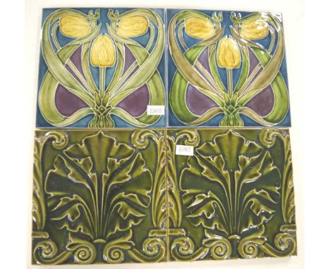 Four vintage Art Deco ceramic tiles including: pair with yellow blossom decoration; and pair with green glazed leaf decoratio