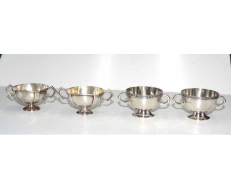 Two pairs of sterling silver salt cellars one pair hallmarked Birmingham 1918, maker: Vale Brothers &amp; Sermon, and the oth