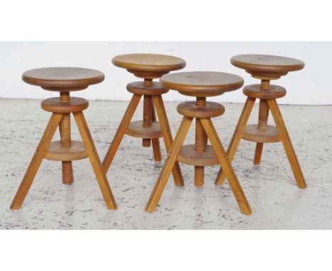 Four tripod based stools with adjustable height. One no longer adjustable.