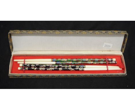 Cased set cloisonne decorated chopsticks comprising 2 pairs chopsticks, each with cloisonne enamel decoration, in presentatio