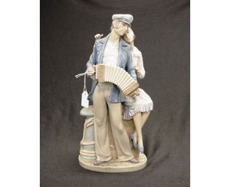 Lladro standing musician &amp; woman figure depicting a standing seaman playing an accordion, with a seated woman admirer, ma
