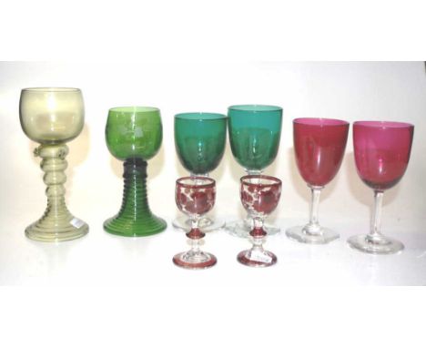 Group six early coloured bowl wine glasses including: near pair of green glasses, and pair ruby glasses, each with clear glas