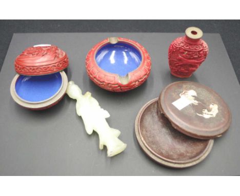 Group of various Oriental trinkets comprising a cinnabar lidded trinket box, ashtray, and snuff bottle, a hard stone Guanyin 