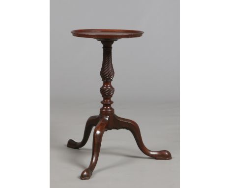 A George III mahogany dish topped kettle stand. Raised on a wrythen carved baluster pedestal on a plain tripod support, 55.25
