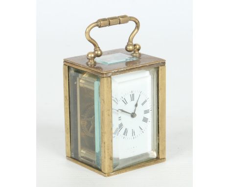 A 19th century miniature brass carriage clock housing a French movement with platform escapement, 8.25cm. Condition Report. T
