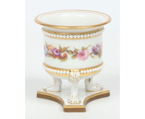 A Worcester Flight, Barr & Barr vase with beaded moulding and raised on three paw feet over a triform plinth. Edged in gilt a